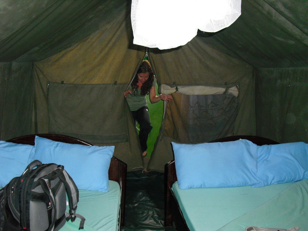 Filmmaker Jordan Salvatoriello enters her tent in the Maasai Mara.
