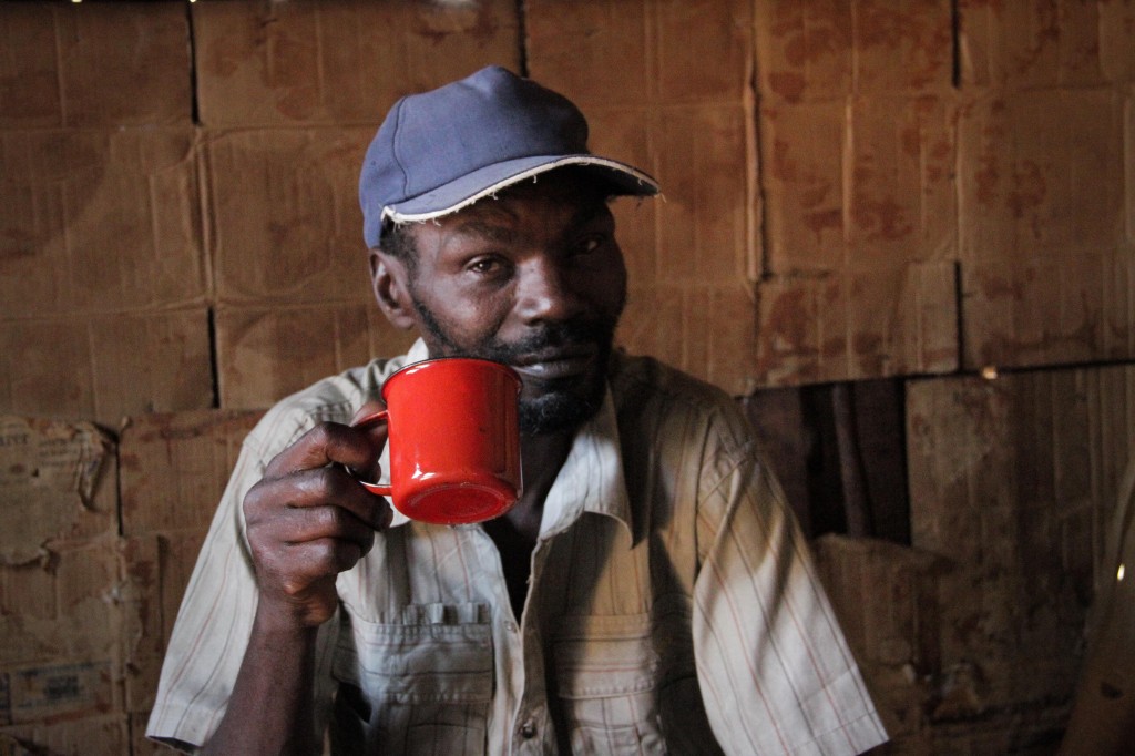 Zipporah's father drinks tea at his home in Maragima.